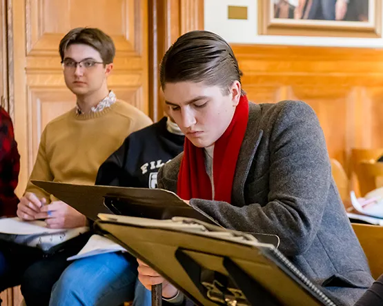 Music composition students working with professor