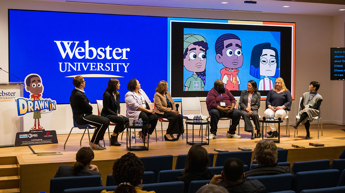 Panel of speakers from Nine PBS sit on stage with animated cartoon images from their show Drawn In on screen behind them.
