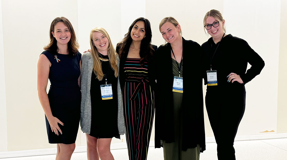 Five WICS Scholars stand together to pose.