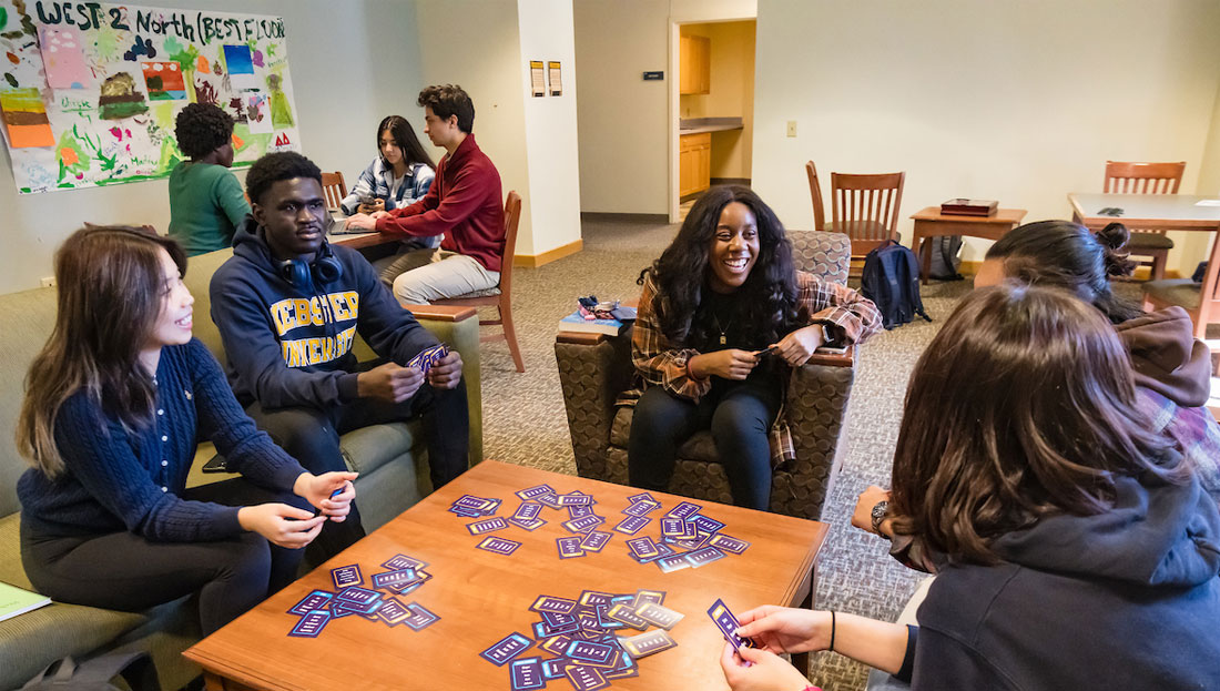 Webster students playing games and studying in their Residence hall.