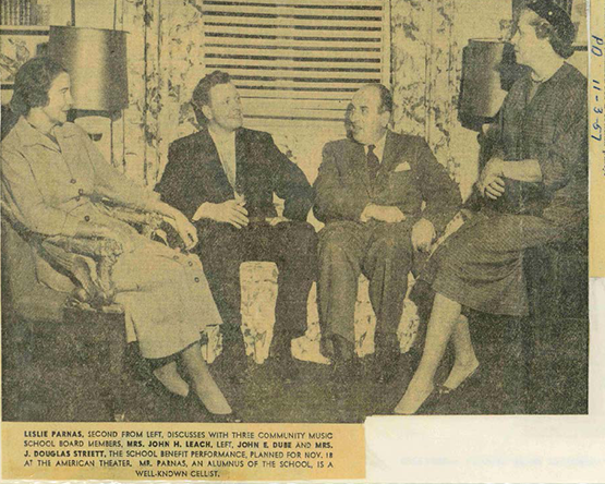 newspaper clipping with Leslie Parnas and others in a meeting