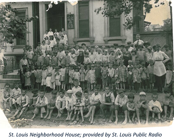 old photo of children gathered in front of a building