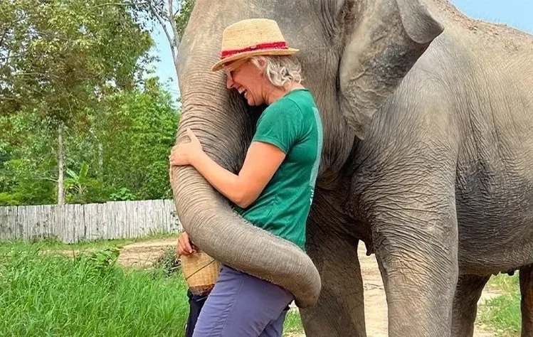 Kristen Guskovict enjoying time with an elephant