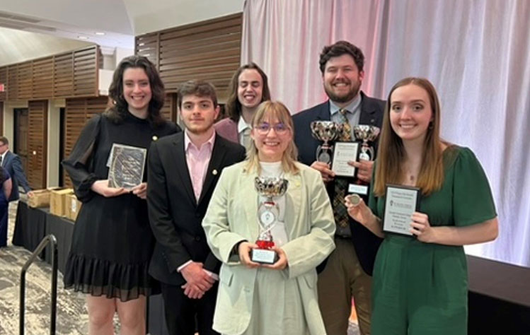 The Webster Forensics and Debate team shows off awards from the Pi Kappa Delta National Tournament and Convention in Phoenix, AZ in March (13 awards in total!). The Forensics team has over 30 national championships and 10 All Americans. 