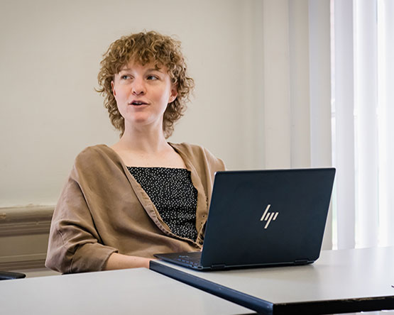 A student engages in classroom discussion.
